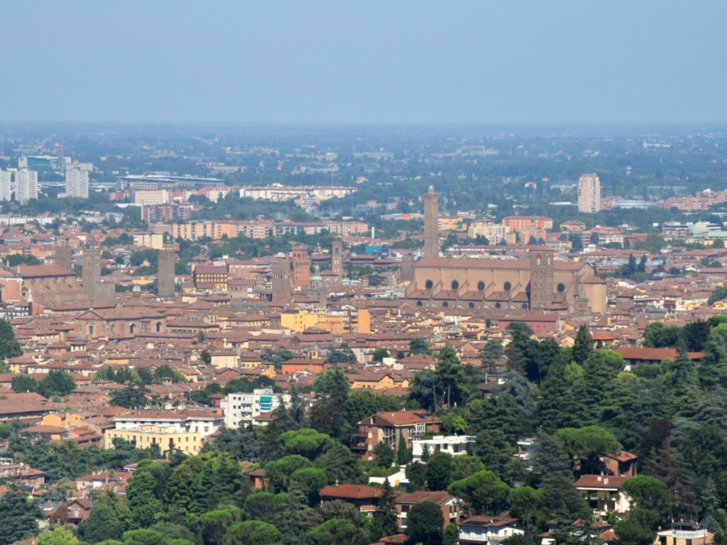 A distant view from the top of the hills over Bologna, Italy, with the cathedral of San Petronio in the centre.